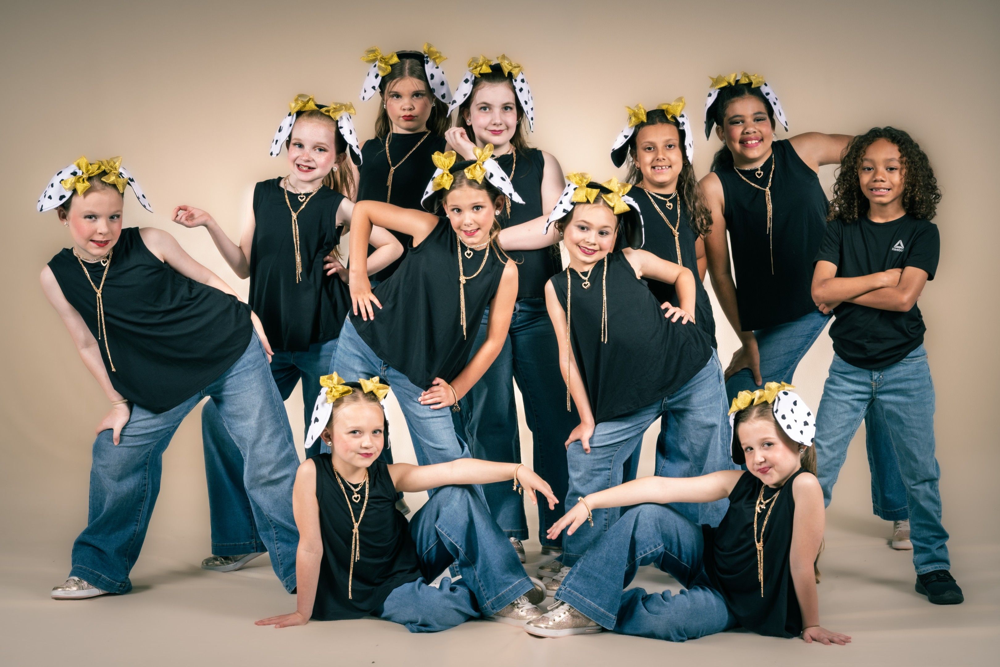 Young company in black tops and polka-dot bandanas