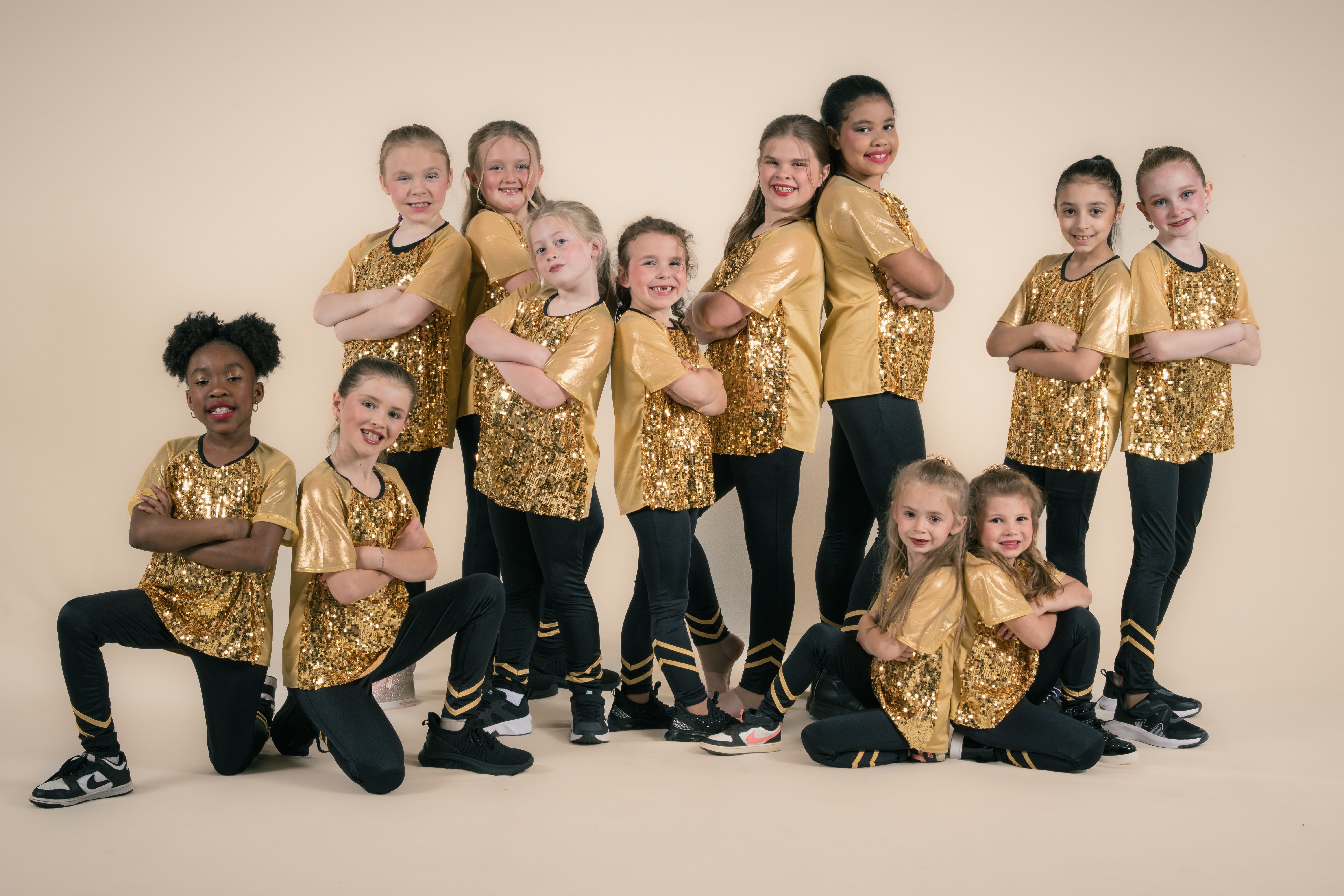 Gold sequins, young dancers in a line