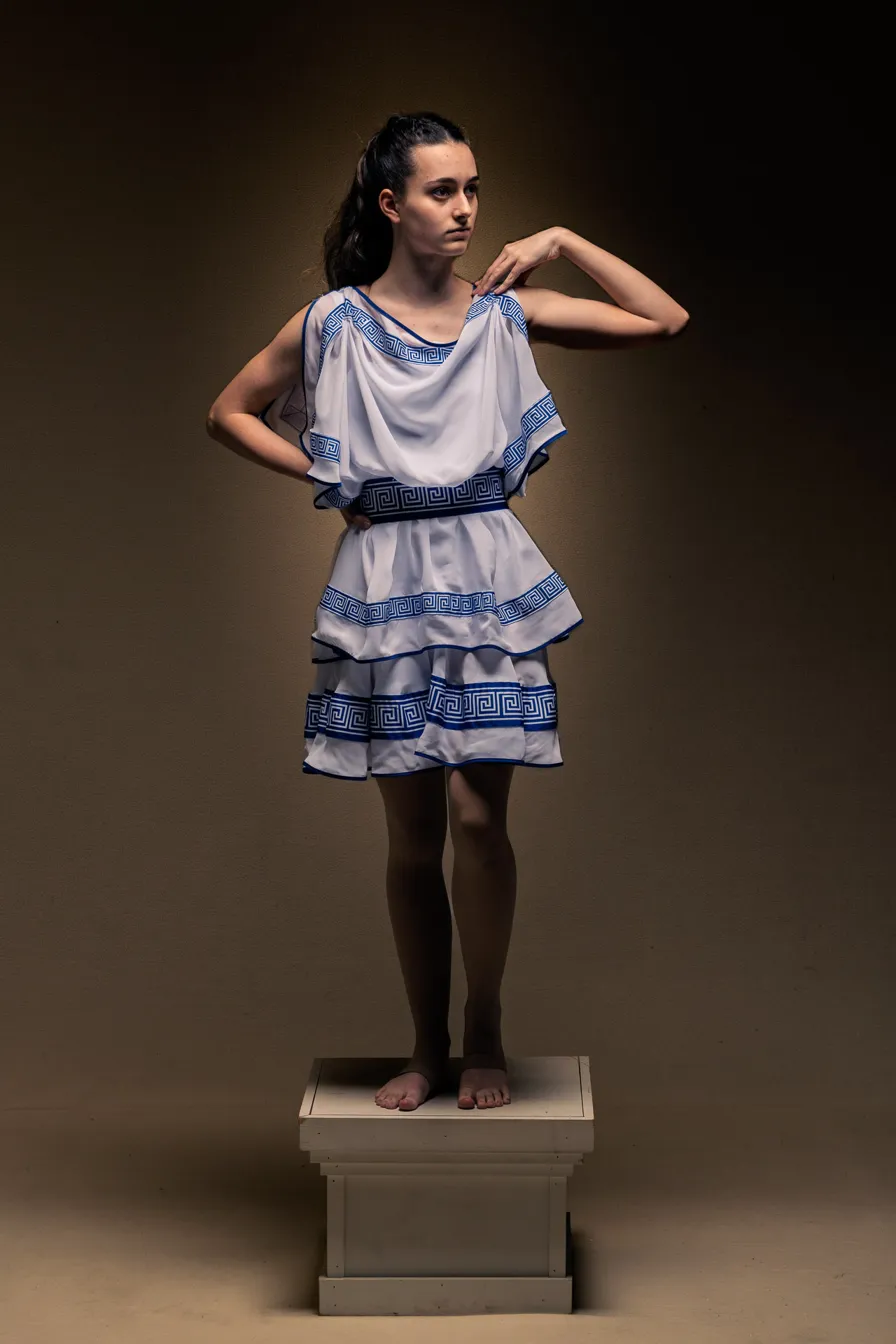 Nimue, portrait in blue-patterned dress