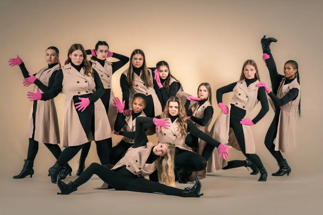 Studio group, trench coats and pink gloves