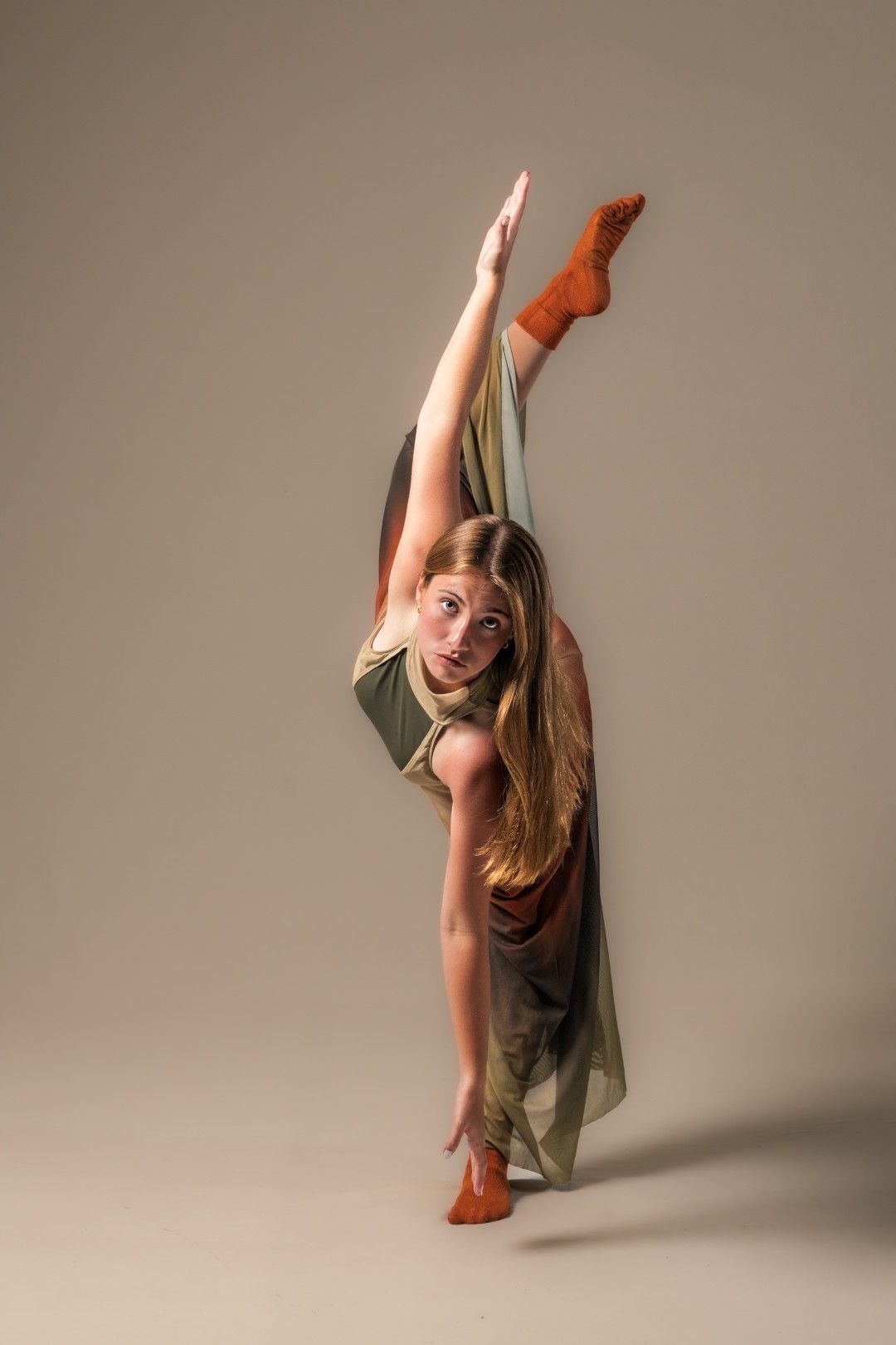 Soloist in ombre dress, doing a tilt