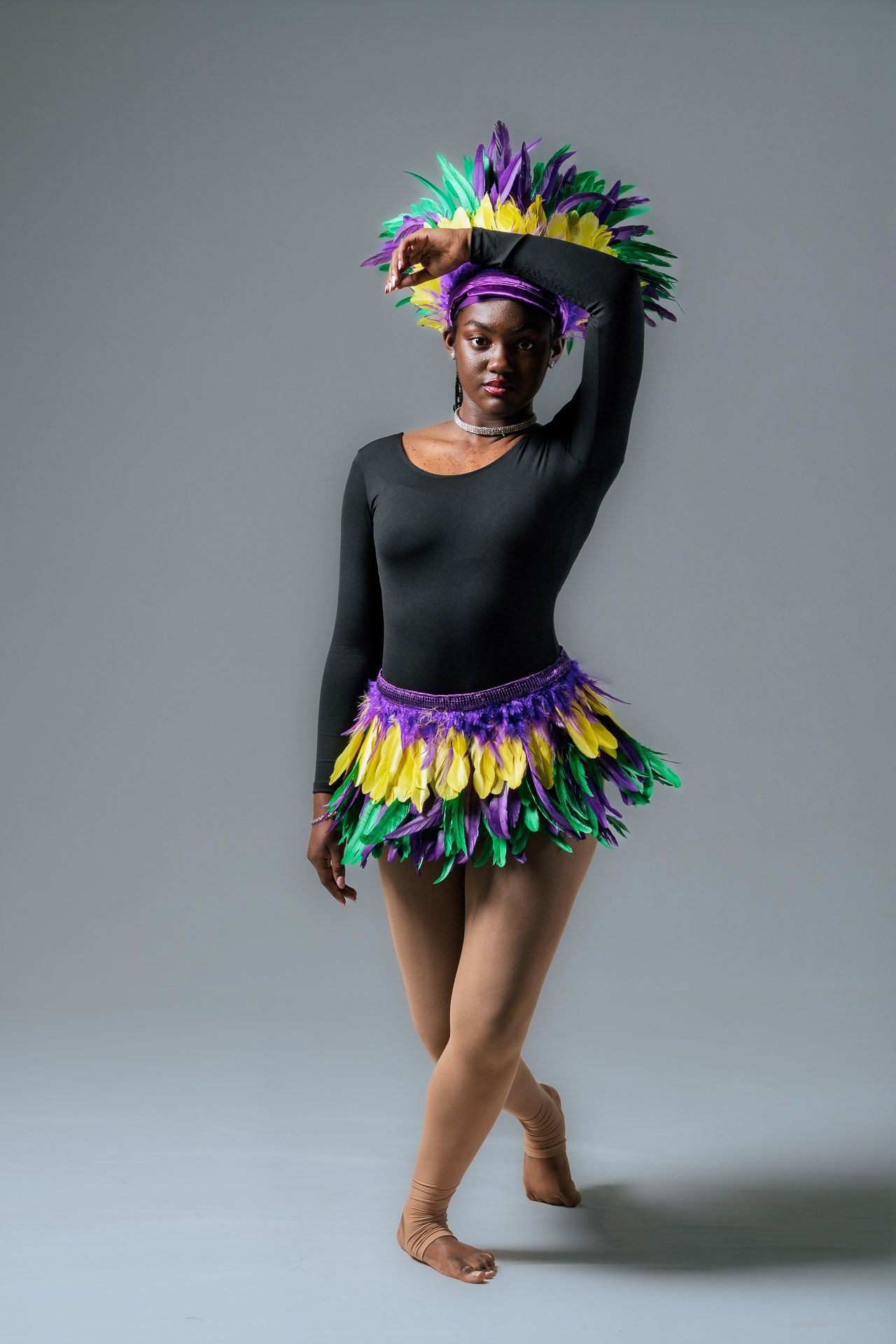 Soloist in feathered headdress and skirt