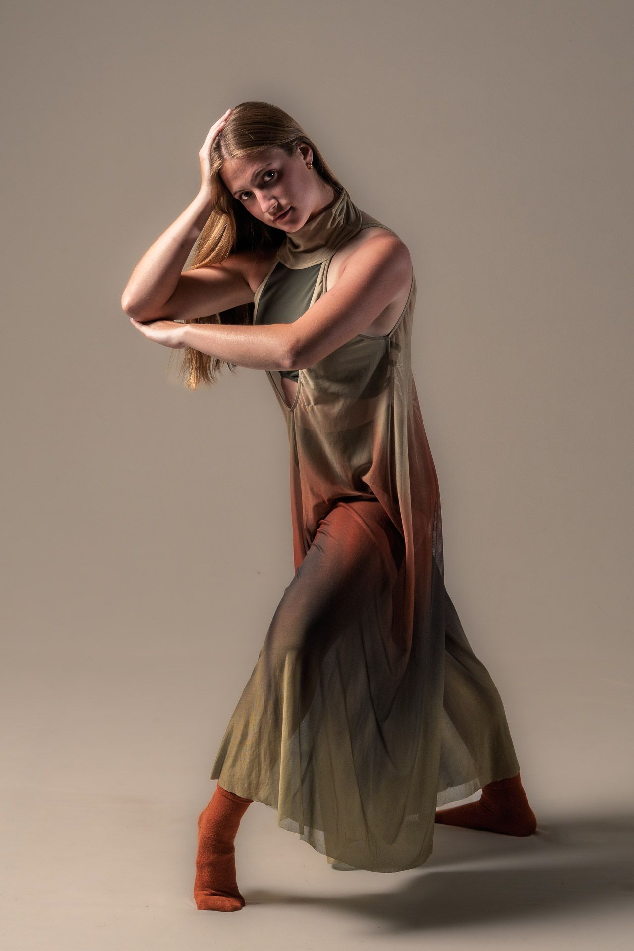 Soloist in ombre dress, hand to head